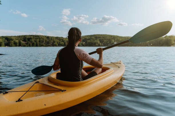 istock Woman kayaking on the lake 1268304645