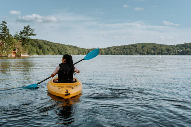 istock Woman kayaking on the lake 1268304671