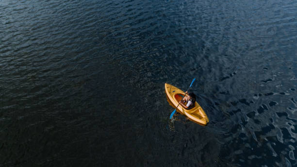 istock Woman kayaking on the lake 1268304716