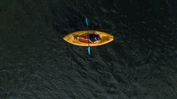 istock Woman kayaking on the lake 1268305248