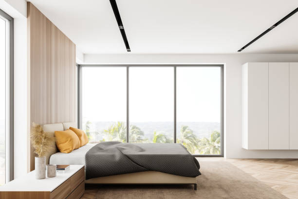 istock White and wooden bedroom with wardrobe 1268307155