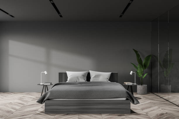 istock Grey and glass master bedroom interior 1268307206
