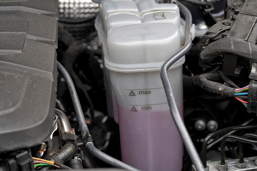 Detail of the coolant expansion tank of a modern car.