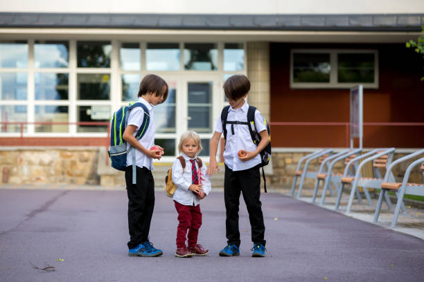 istock School children, boys, going back to school after the summer vacation 1268308726