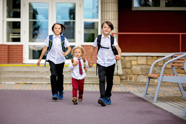 istock School children, boys, going back to school after the summer vacation 1268313563