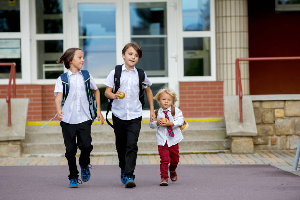 istock School children, boys, going back to school after the summer vacation 1268314073