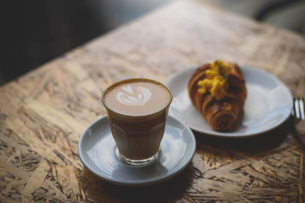 istock Breakfast with cup of coffee and croissants 1268316161