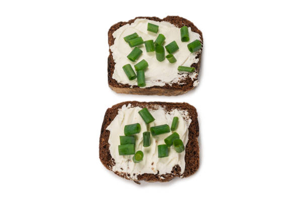istock Brown bread and cheese isolated on white background. 1268317222