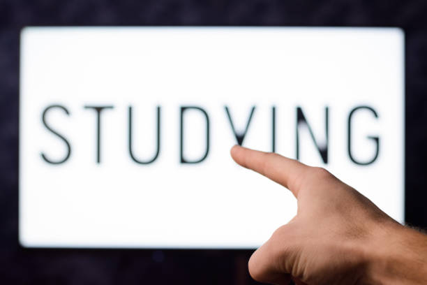 istock Man pointing to a screen with inscription STUDY showing importance of knowledge nowadays 1268317978