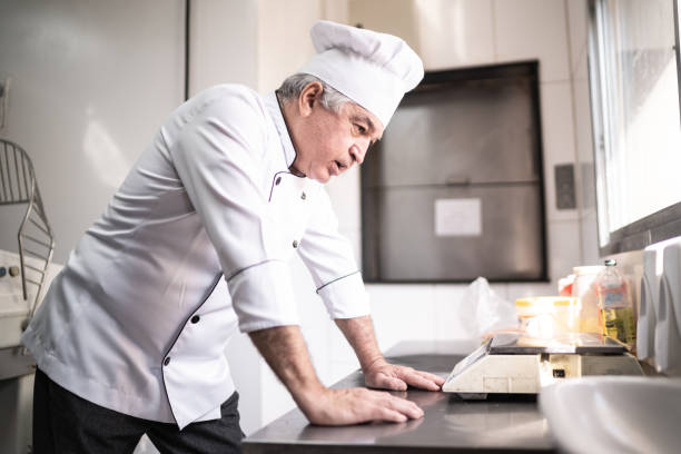 istock Worried senior baker in a commercial kitchen 1268320028
