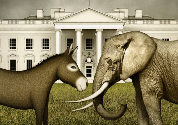 istock Donkey Facing Elephant in front ofd the White House 1268321464