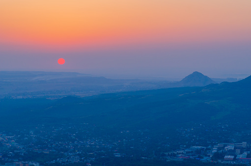 View of the city of Pyatigorsk from the top of Mashuk mountain at sunset. Stavropol Territory of the Russian Federation