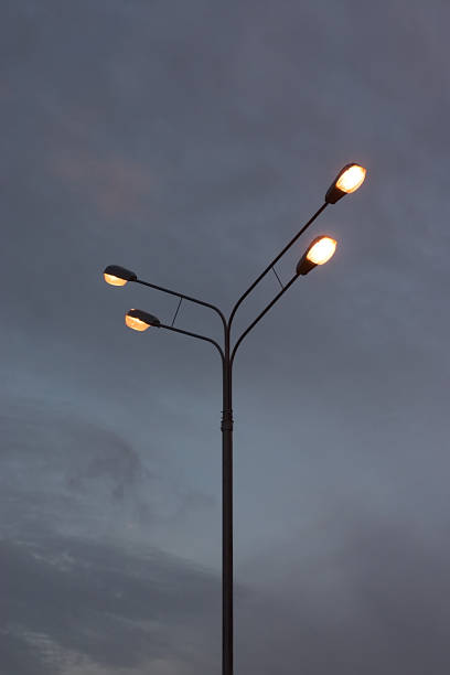 istock A pole with electric lights against the twilight sky 1268327540