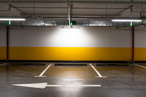 Underground parking. Free space for a car in a shopping center