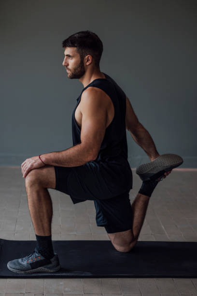 istock Man in Sportswear Warming Up before the Workout 1268332667