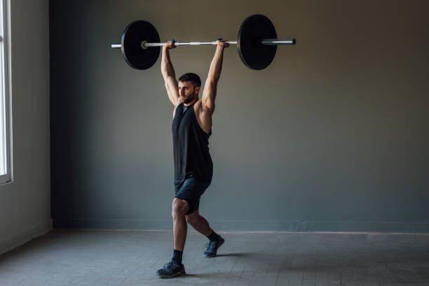 istock Athlete Exercising by Lifting Barbells, cross training Strength Training Concept 1268332708