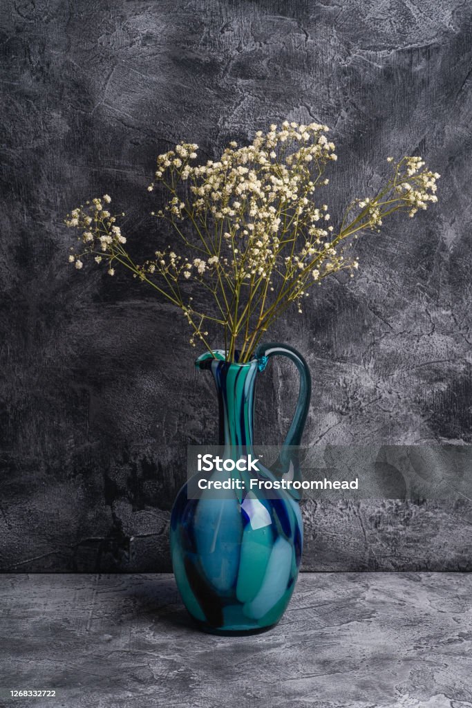Blue Jug Vase With Bulk Gypsophila Dried White Flowers On Dark