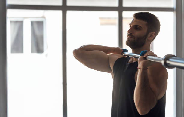 istock Athlete Holding a Bar during the Workout, cross training Strength Training Concept 1268332741