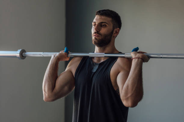 istock Athlete Holding a Bar during the Workout, cross training Strength Training Concept 1268332749