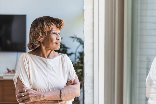 istock Daydreaming senior woman 1268333174