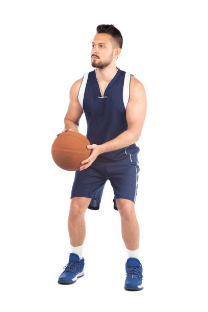 istock Man in blue jersey playing basketball 1268334471