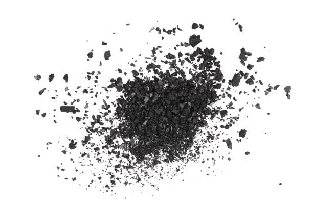 istock Pile of coal carbon or charcoal dust isolated on white background 1268335613