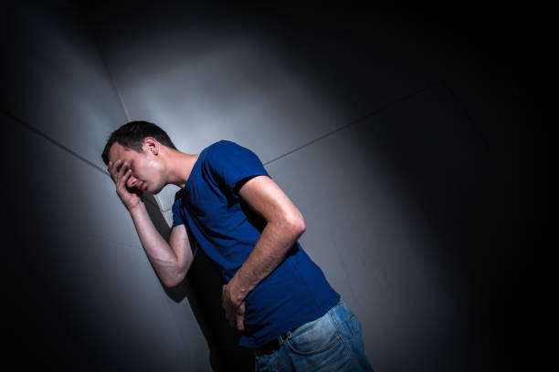 istock Young man suffering from severe belly pain 1268342901