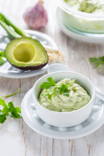 Delicious avocado spread with curd cheese and ingredients. Heathy food concept. Delicious avocado spread with curd cheese and ingredients. Heathy food concept. heathy stock pictures, royalty-free photos & images