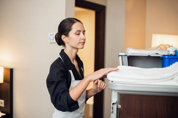 istock A young uniformed maid getting some fresh towels 1268344333
