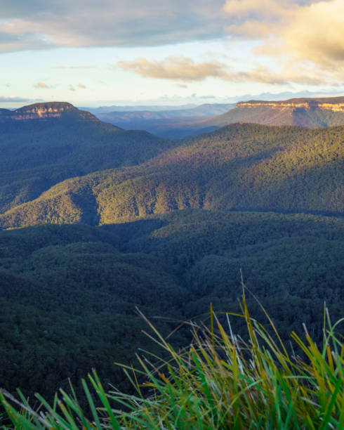 istock Mountain landscape at sunrise with clouds 1268346020
