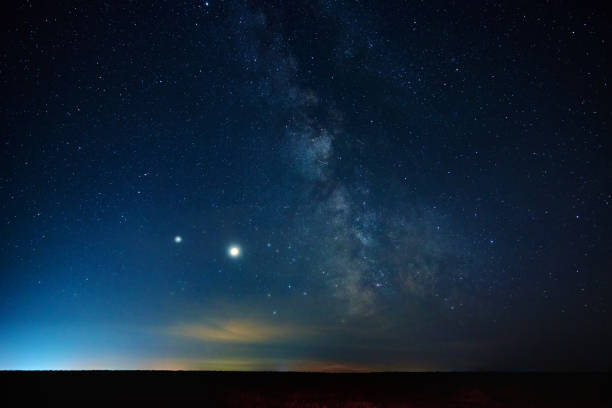 istock Milky way galaxy. Night sky landscape with stars 1268346115