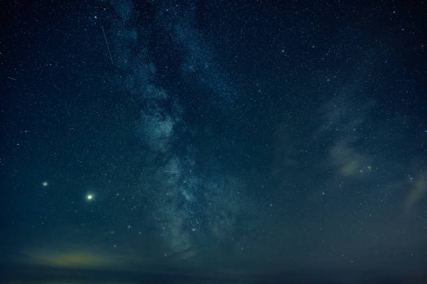 istock Milky way galaxy. Night sky landscape with stars 1268346117