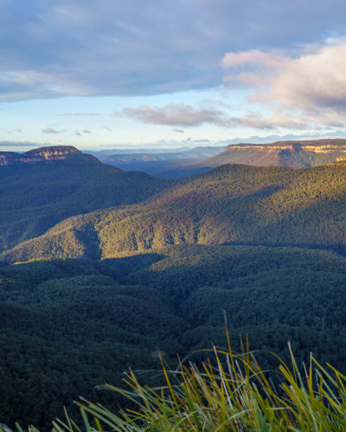 istock Mountain landscape at sunrise with clouds 1268346195