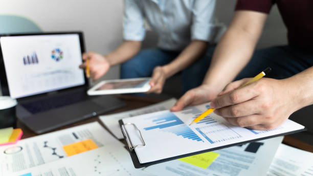 istock Financial inspector calculating a numbers in office room. 1268346289
