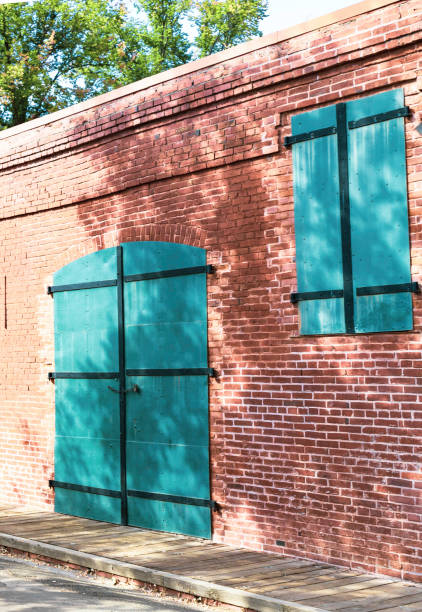 istock red brick building and blue doors 1268349872