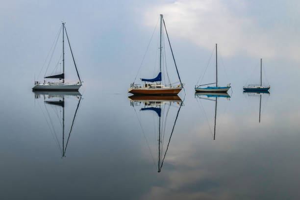 istock Misty Morning with Boats and Reflections on the Bay 1268354419