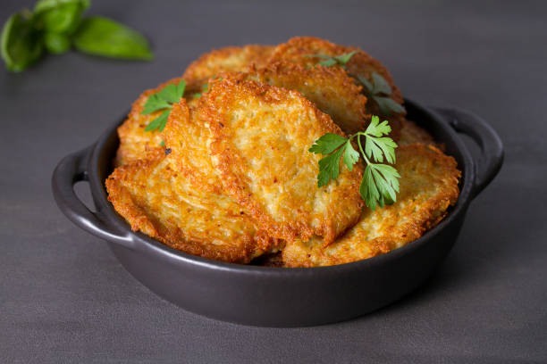 istock Potato Cakes. Vegetable fritters, latkes, draniki. Vegetable pancakes 1268355379