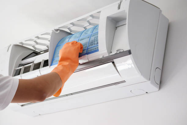 istock Asian man hand hold air conditioner filter cleaning concept 1268358326