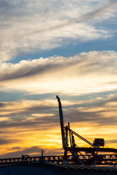 istock Early morning clouds and a giant crane. 1268363863
