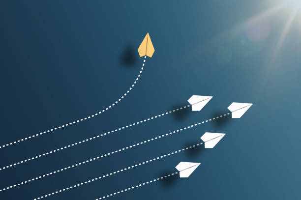 top view of paper planes against blue background