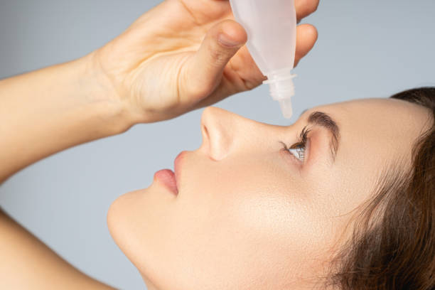 istock Female applying a liquid medication for eyes 1268364050