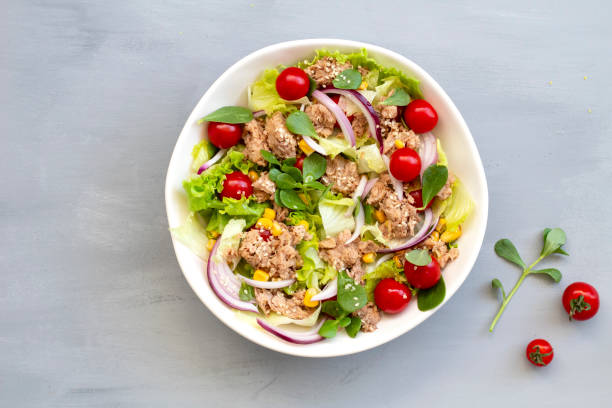 istock tuna salad in white bowl, top view, copy space 1268364859
