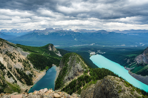 Moody panoramic view showing Lake Louise and Lake Agnes in Banff National Park, Alberta, Canada.