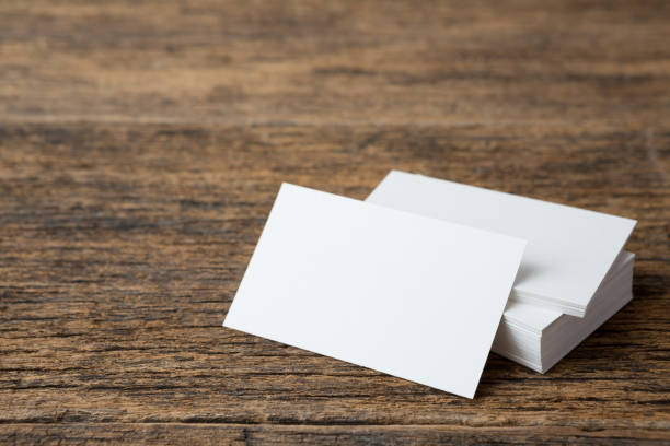 istock Stack of Business card on wood background and copy space 1268367818