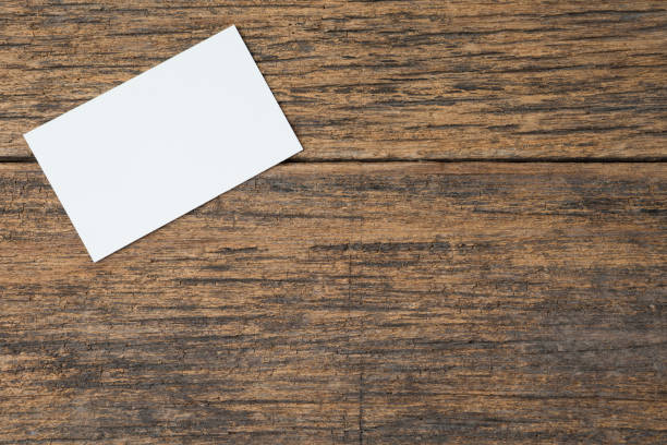 istock Business card on wood background and copy space 1268367850