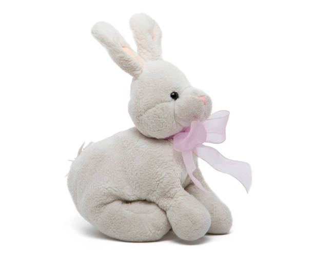 istock White teddy rabbit, soft toy in child's on white background. 1268372912