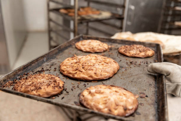 istock baker in the bread production on the table 1268373163