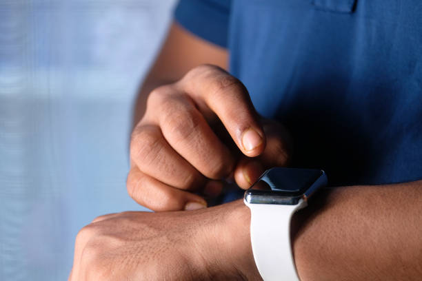 istock top view of man's hand using smart watch. 1268374970