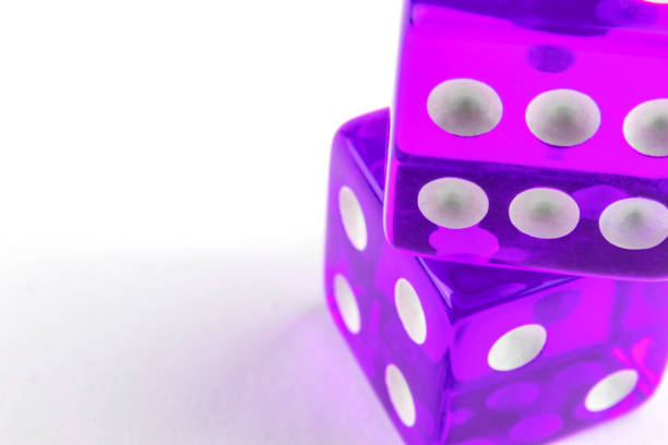 istock Two purple bones one on another, isolated on white background with copy space, top view, soft selective focus. 1268381385