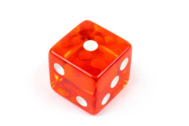 istock A red glass dice isolated on a white background with a shadow, one. 1268381422